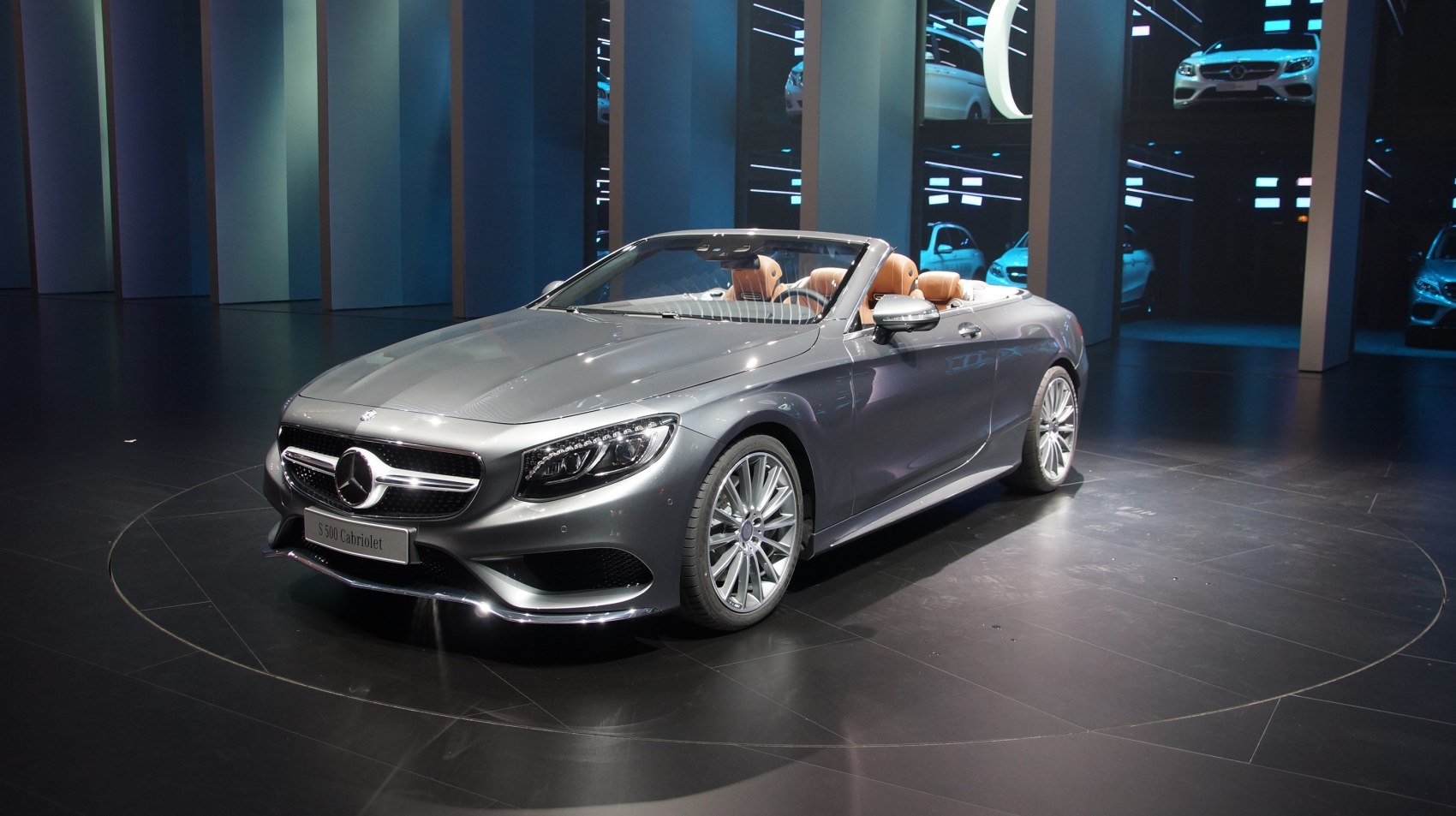 Luxury convertible with sleek front design and detailed headlights