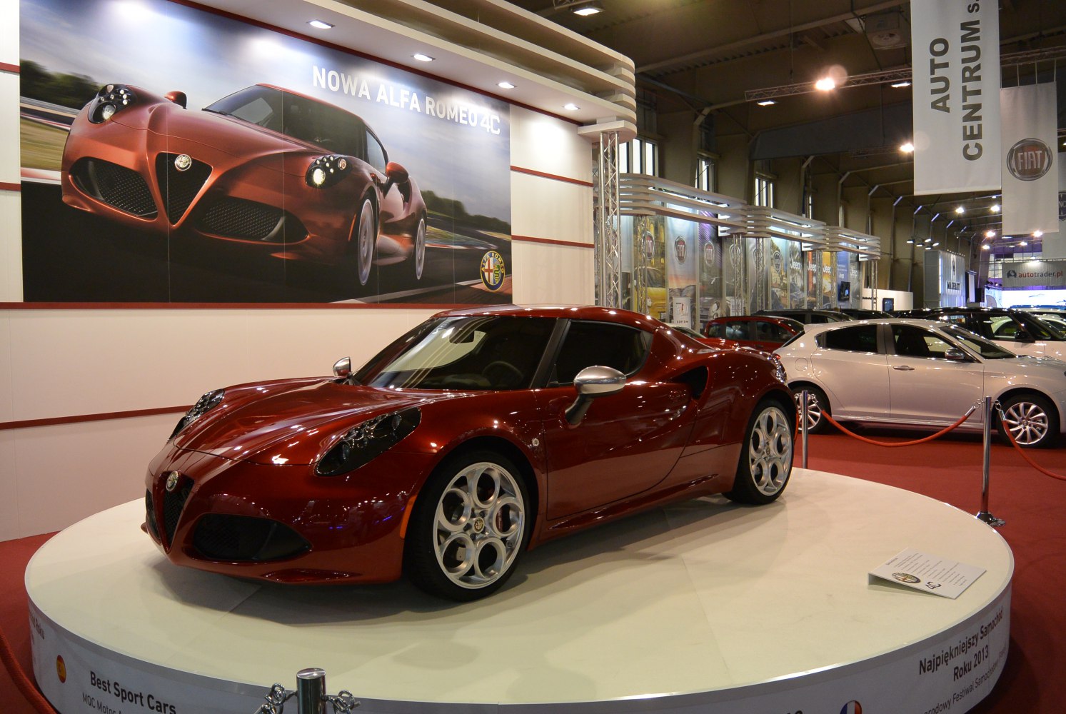 Red aerodynamic sports coupe with signature round alloy wheels