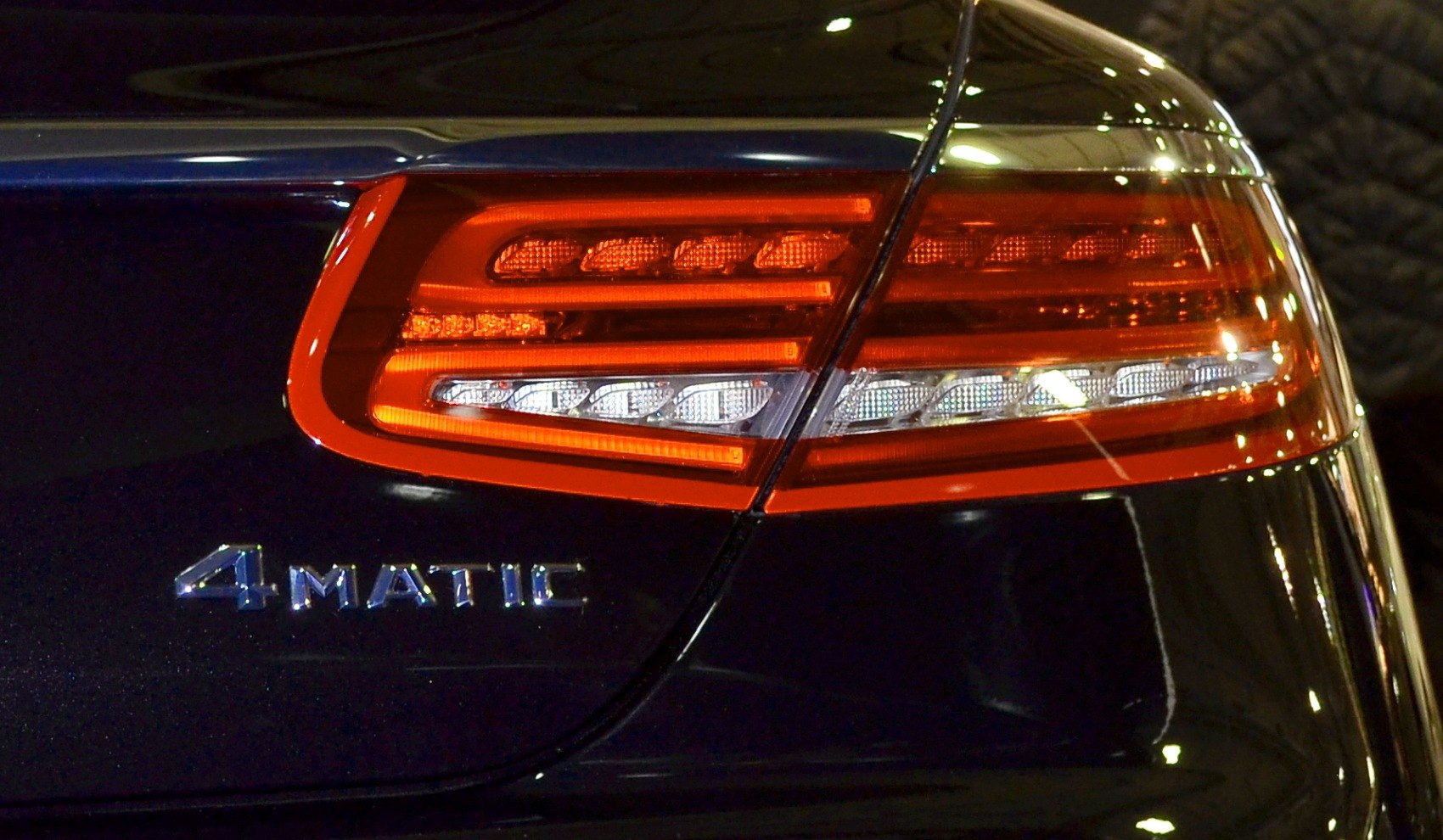 LED rear tail light and 4MATIC badge on dark car body