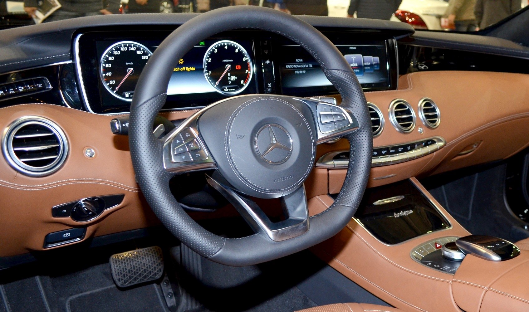 Luxury leather steering wheel and digital dashboard with analog gauges