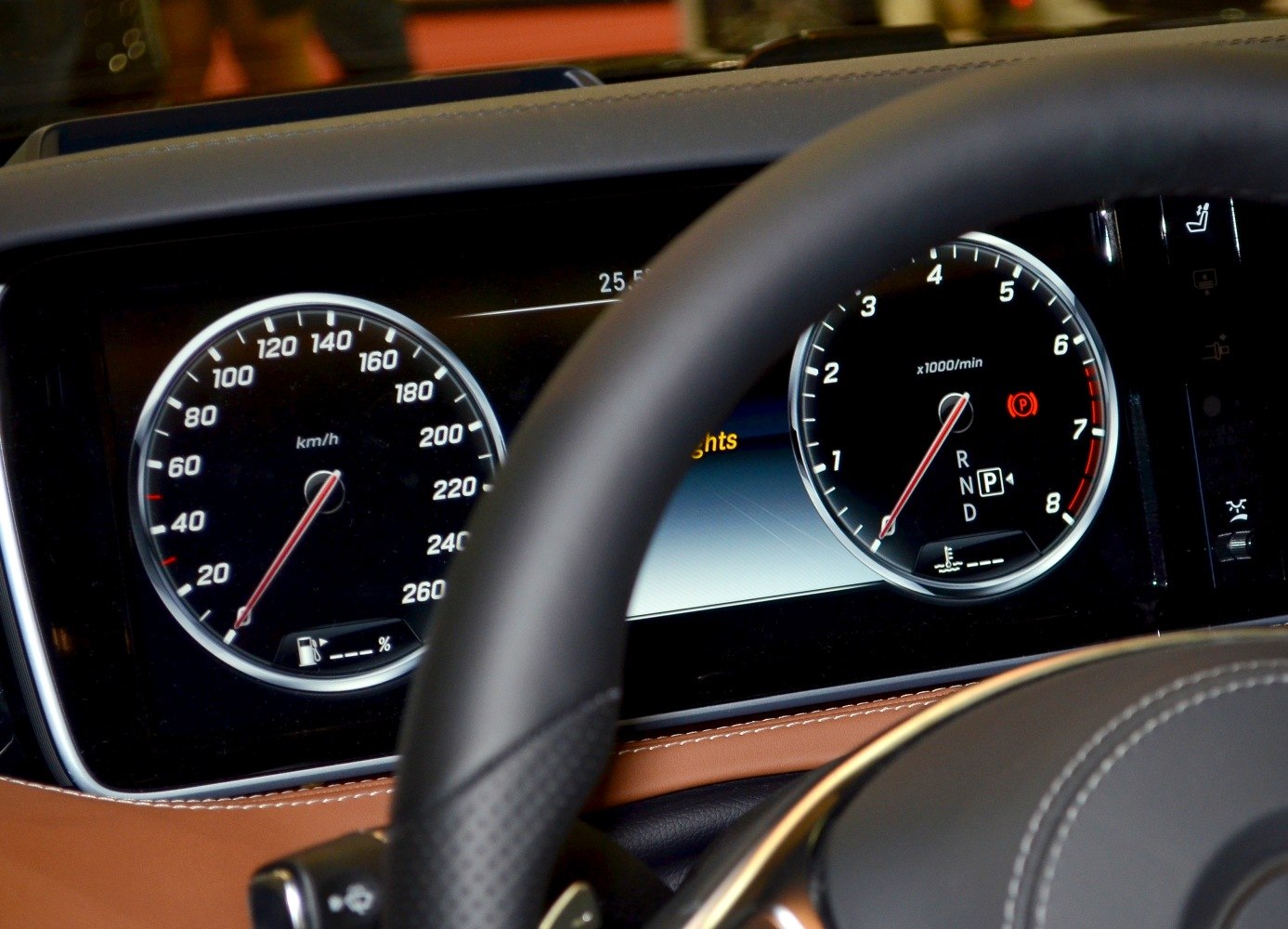 Digital speedometer and tachometer in luxury coupe interior