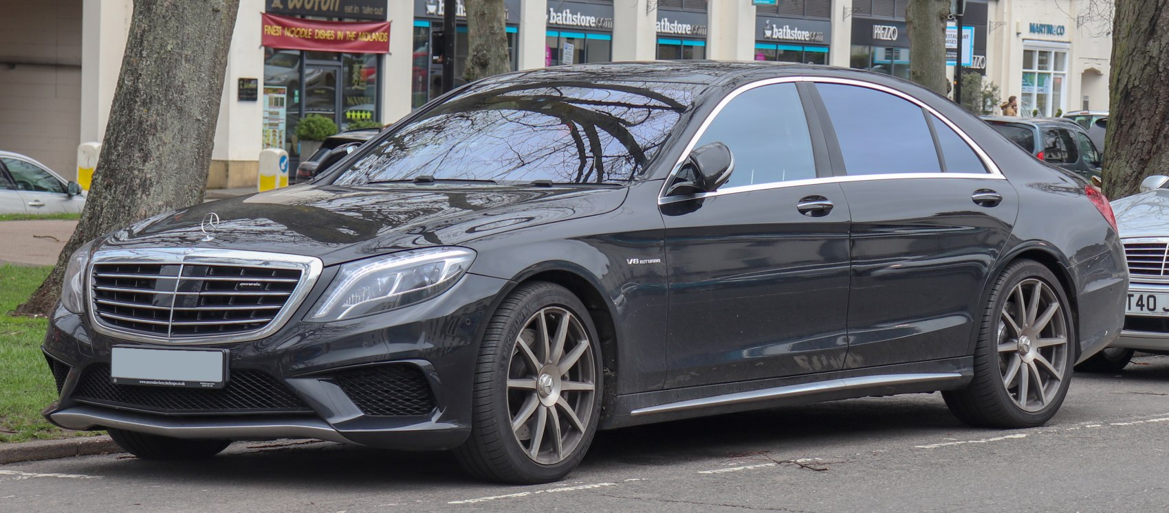 Luxury sedan with AMG front grille and V8 biturbo badge