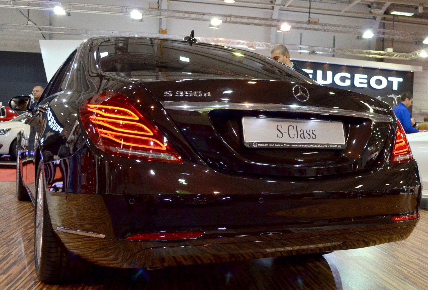 Rear view with illuminated LED tail lights and chrome trim