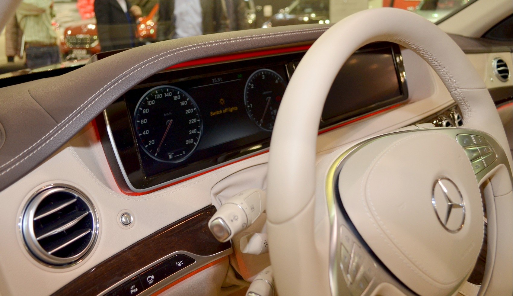 Digital instrument cluster and luxury dashboard interior with beige leather and wood trim