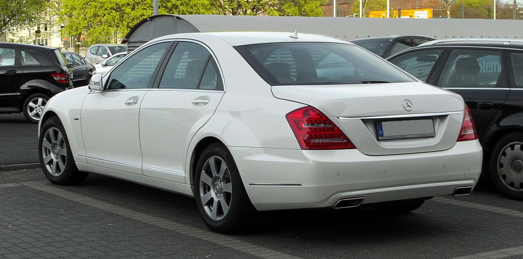 Rear view of luxury sedan with distinct taillights and chrome trim