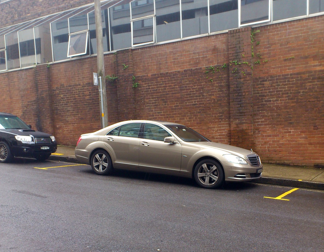 Sleek luxury sedan side profile with alloy wheels