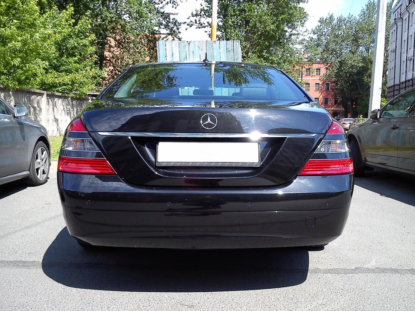 Rear view of a luxury sedan with chrome trim and distinctive tail lights