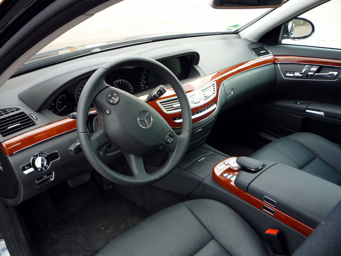 Luxury dashboard and wood trim interior with multifunction steering wheel