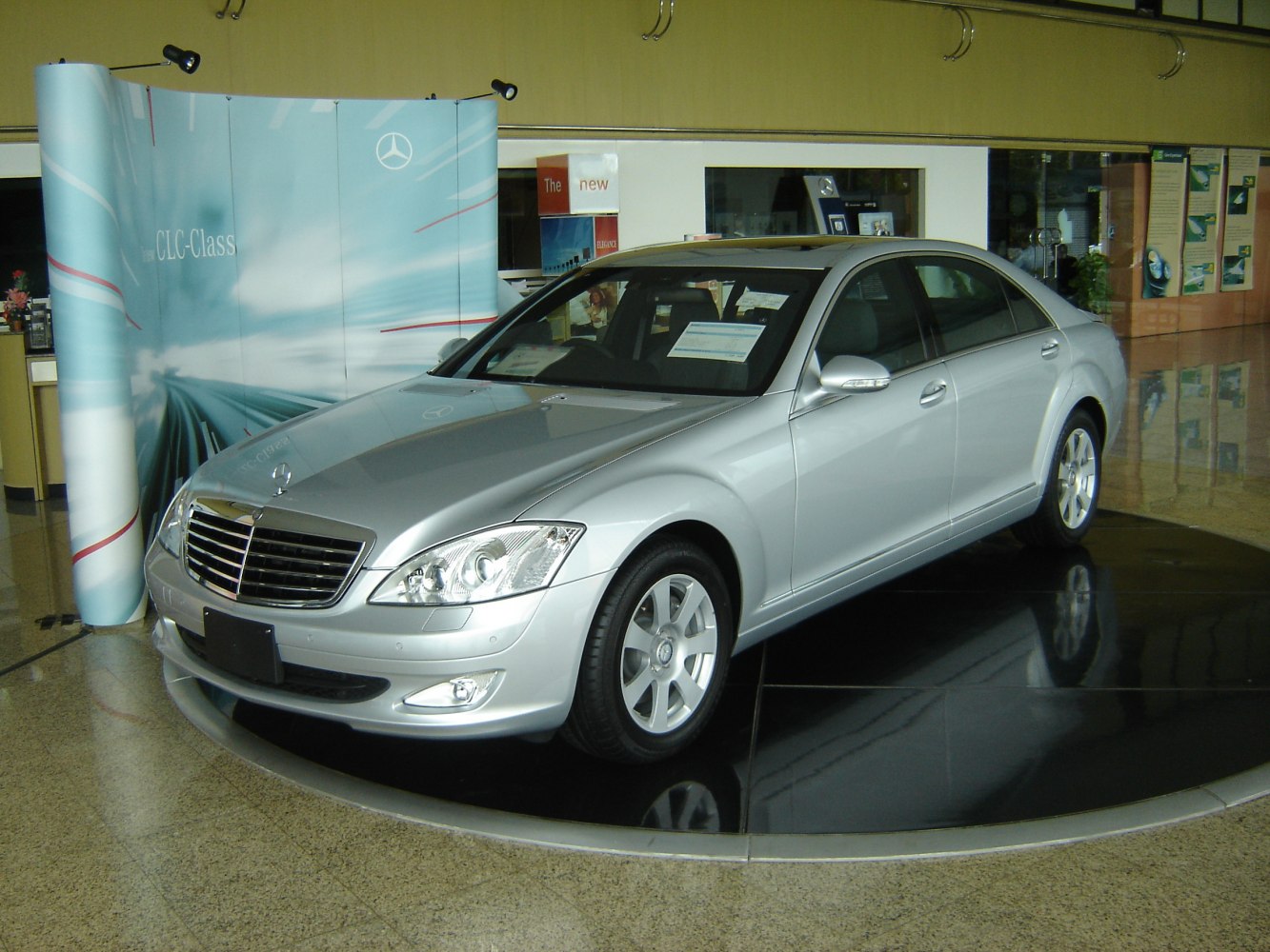 Silver luxury sedan with prominent grille and headlights