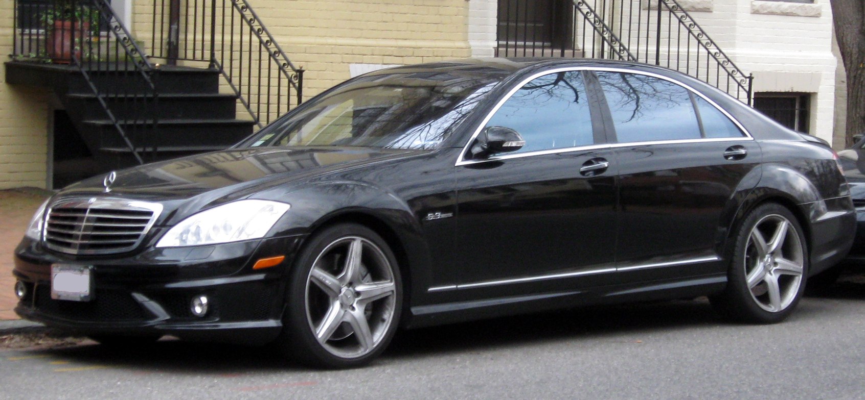 Luxury sedan with sporty alloy wheels and chrome trim.