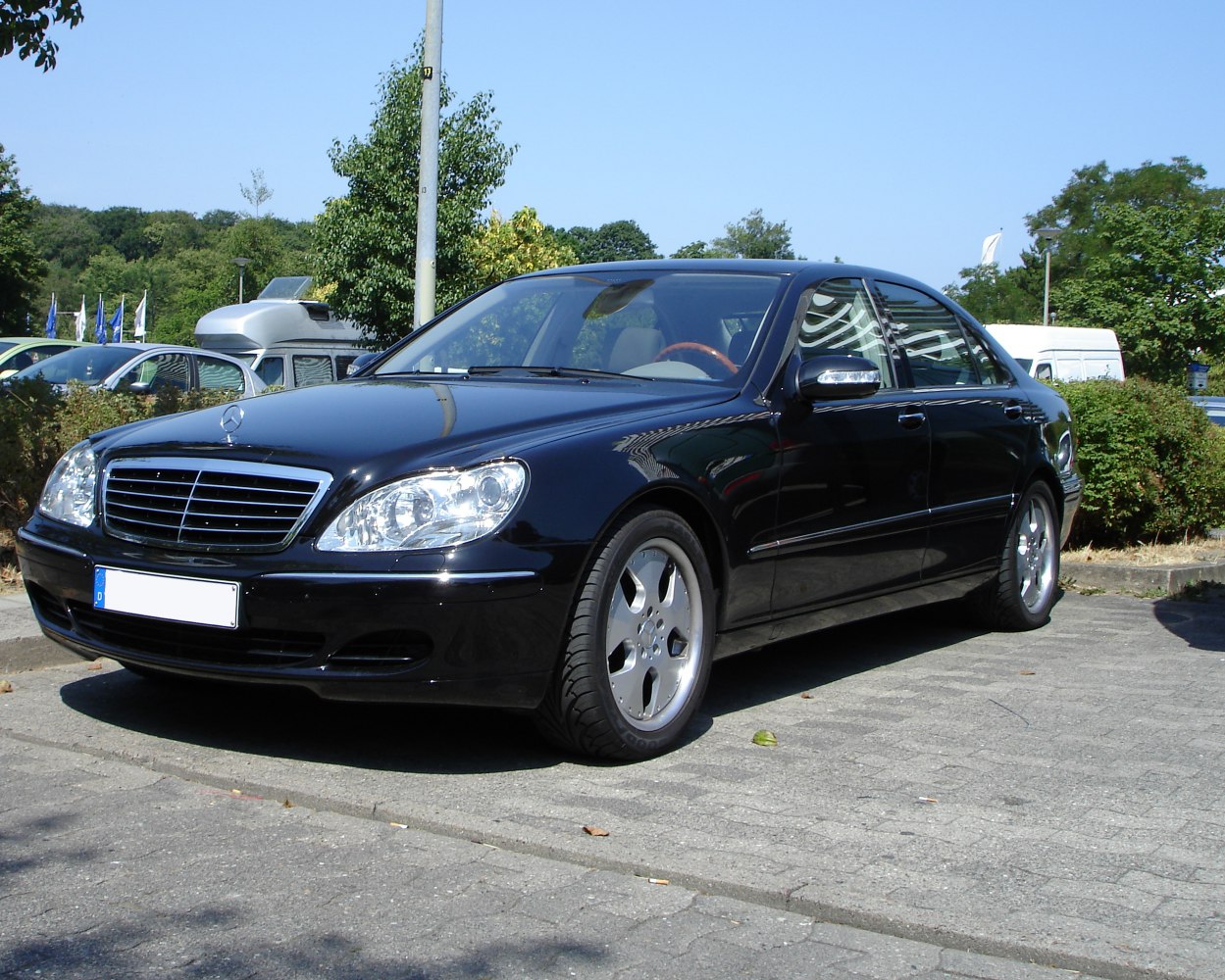 Front and side view of a luxury sedan with alloy wheels