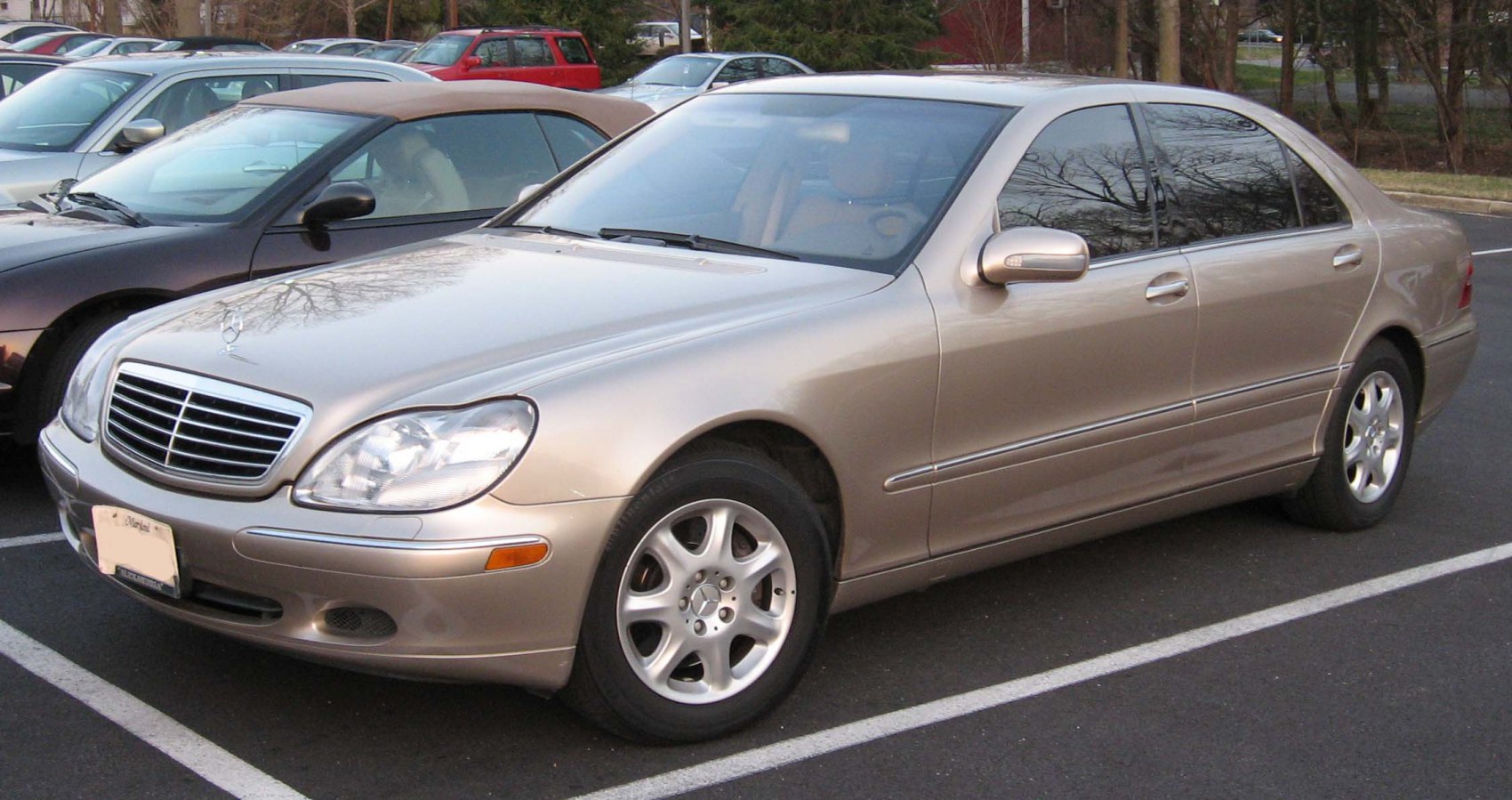 Front-side view of a luxury sedan with classic grille and alloy wheels