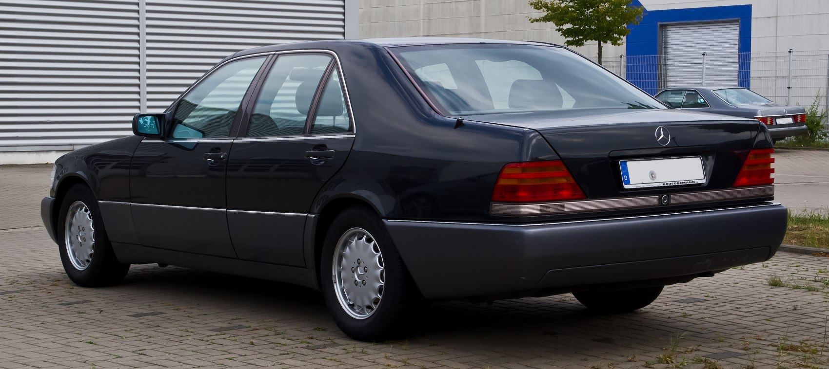 Rear side view with distinct taillights and alloy wheels.