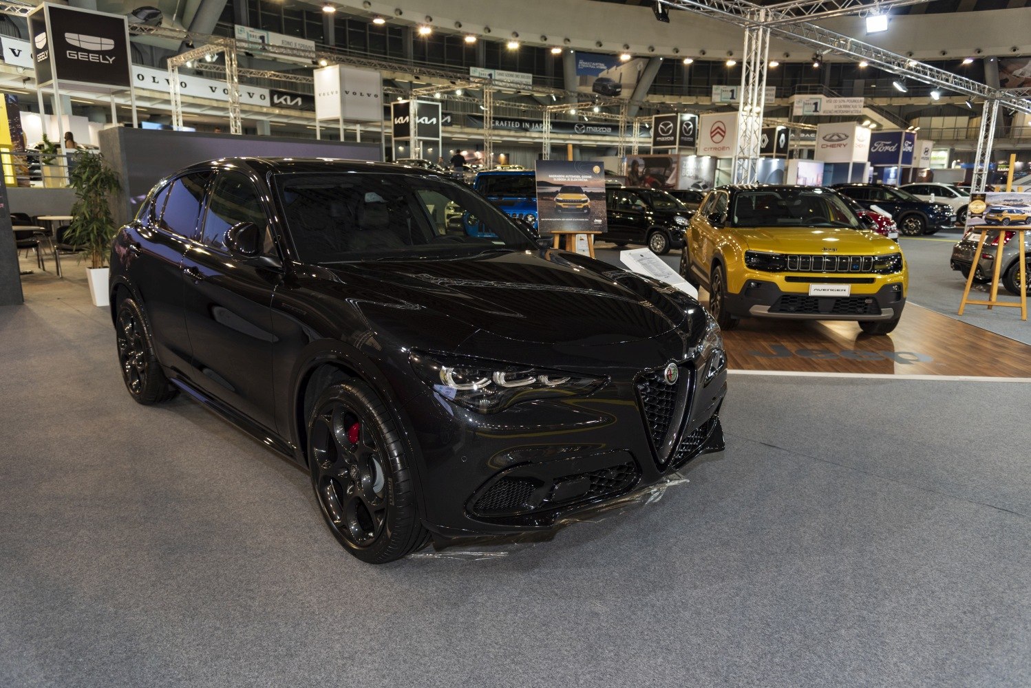 Sporty black SUV front view with LED headlights and aggressive grille
