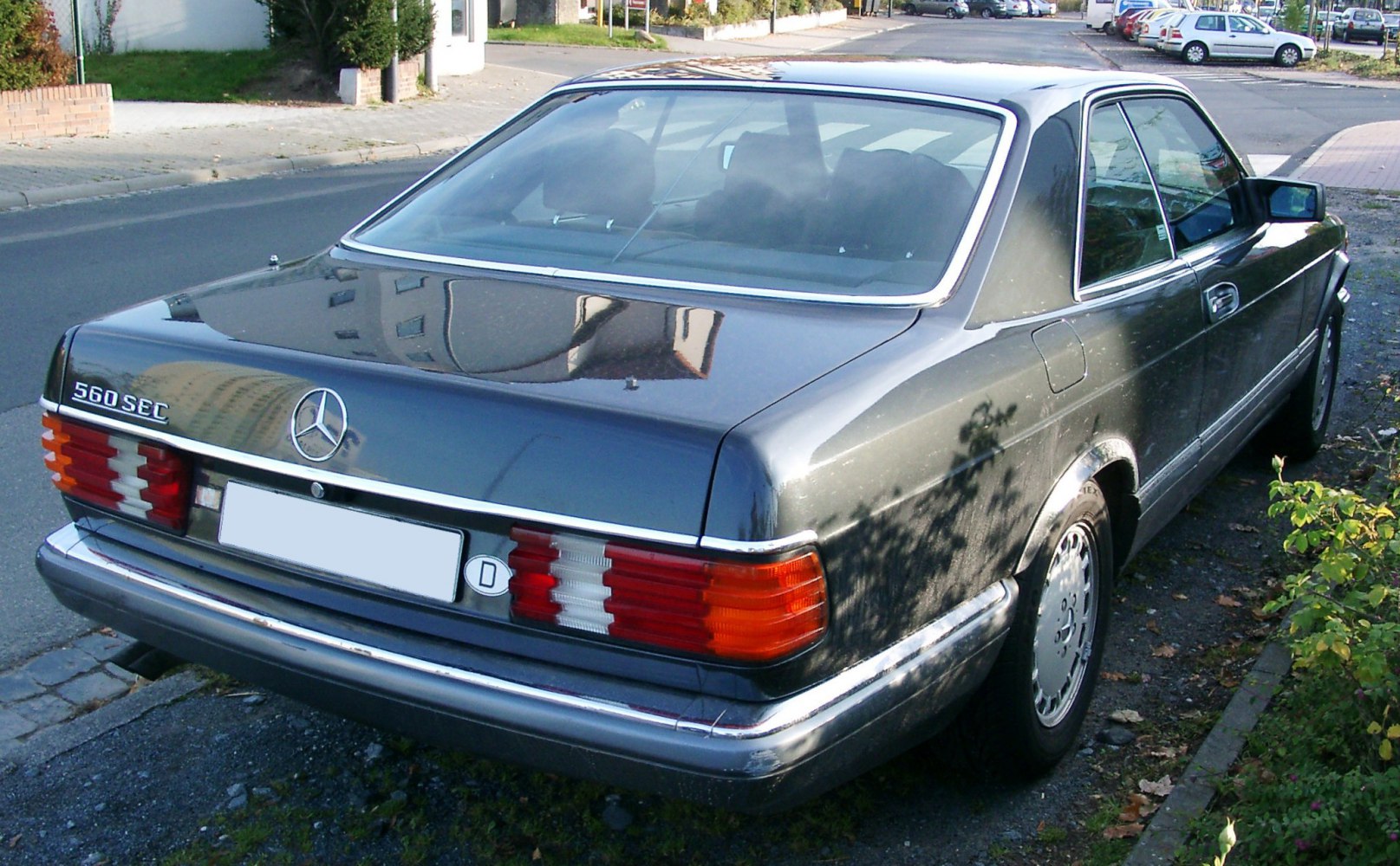 Rear view with tail lights, chrome bumper of classic luxury coupe