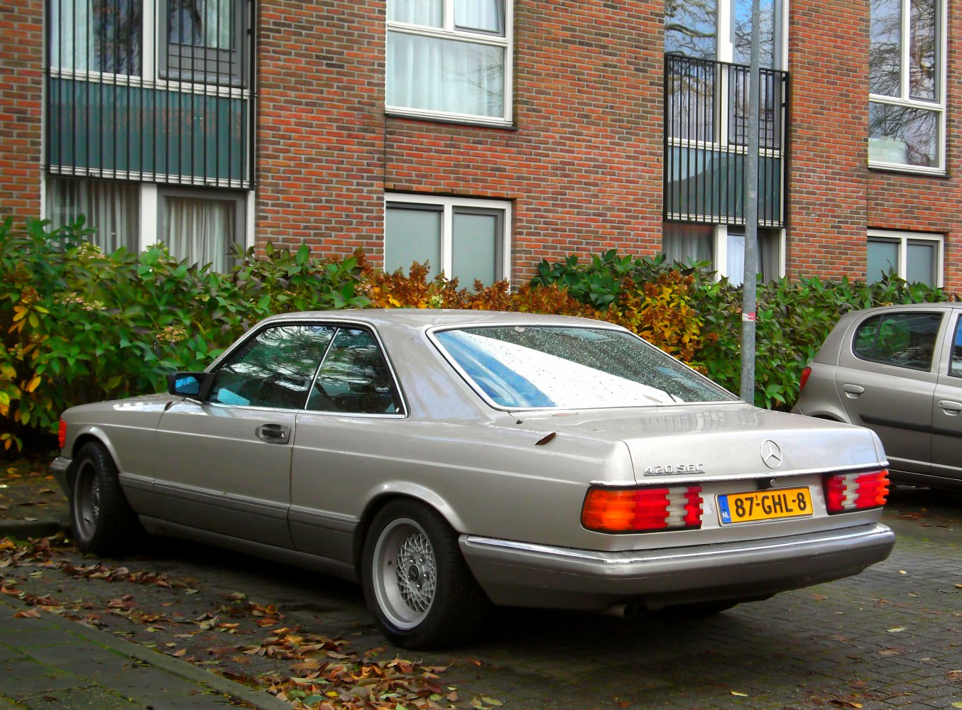 Rear-side view of 1980s coupe with distinctive taillights and smooth body lines