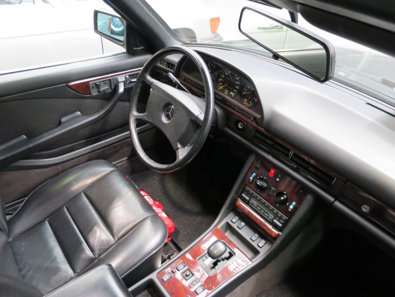 Vintage luxury coupe interior with detailed dashboard and leather seats