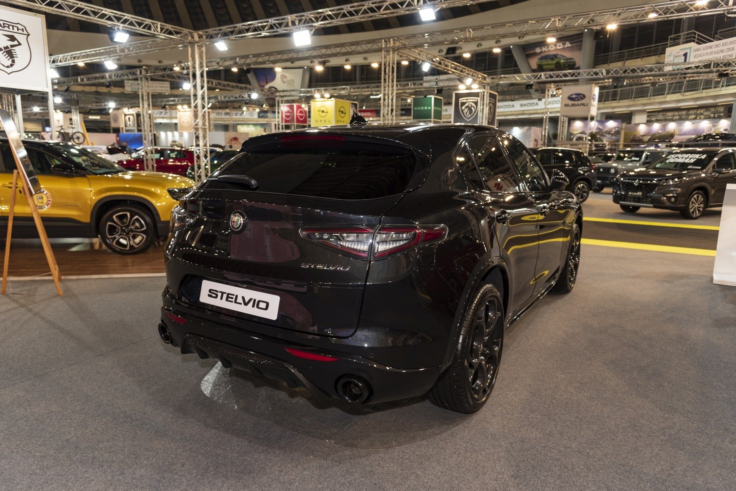 Rear view of a black SUV with sleek taillights and sporty diffuser