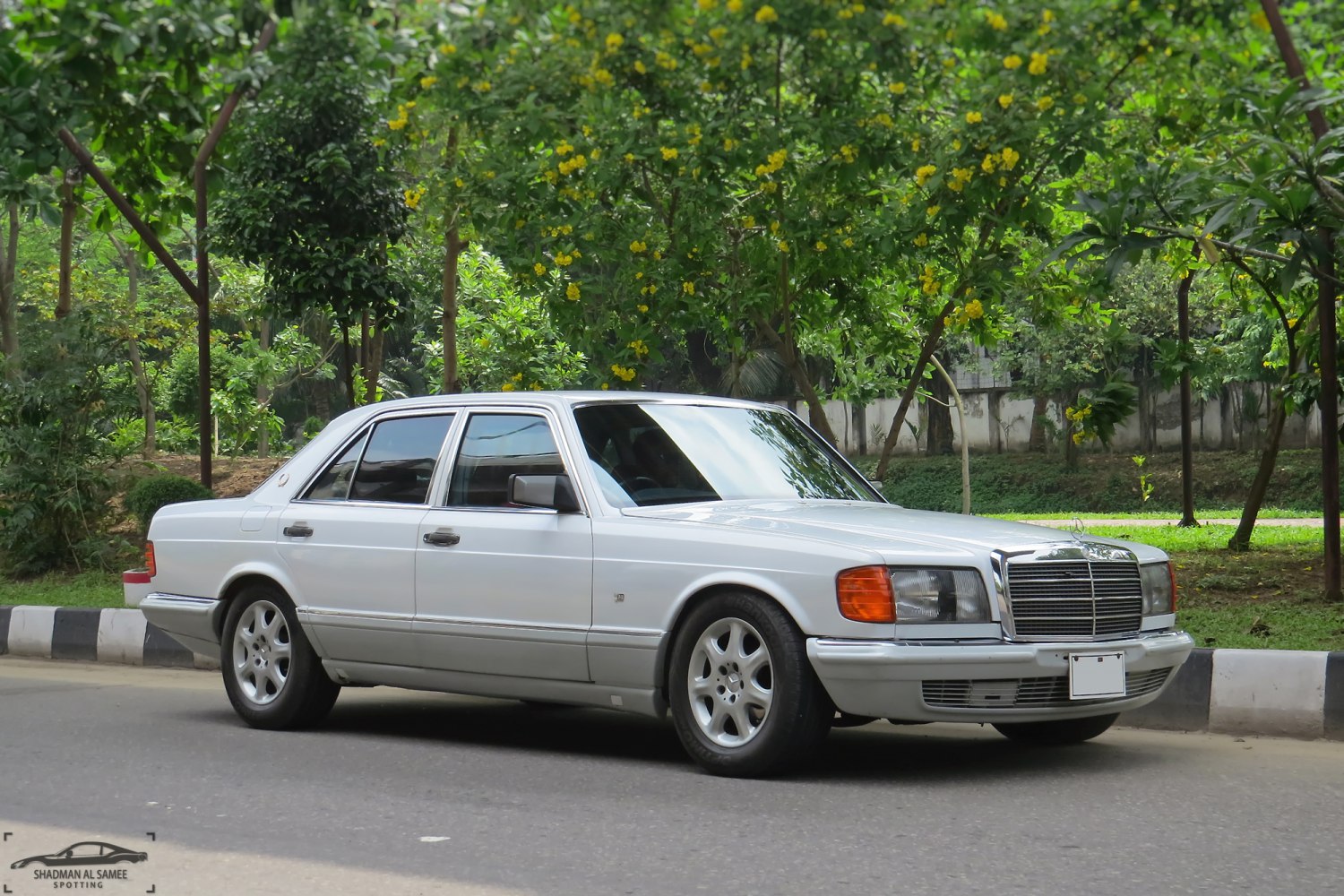 Classic luxury sedan with chrome grille and sealed beam headlights