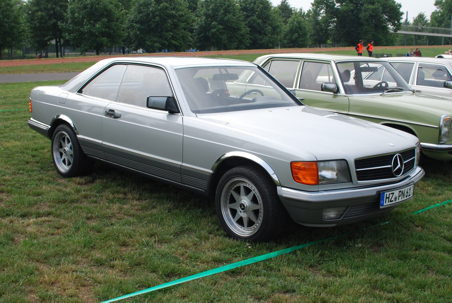 Luxury two-door coupe with AMG-style alloy wheels and chrome fender details.