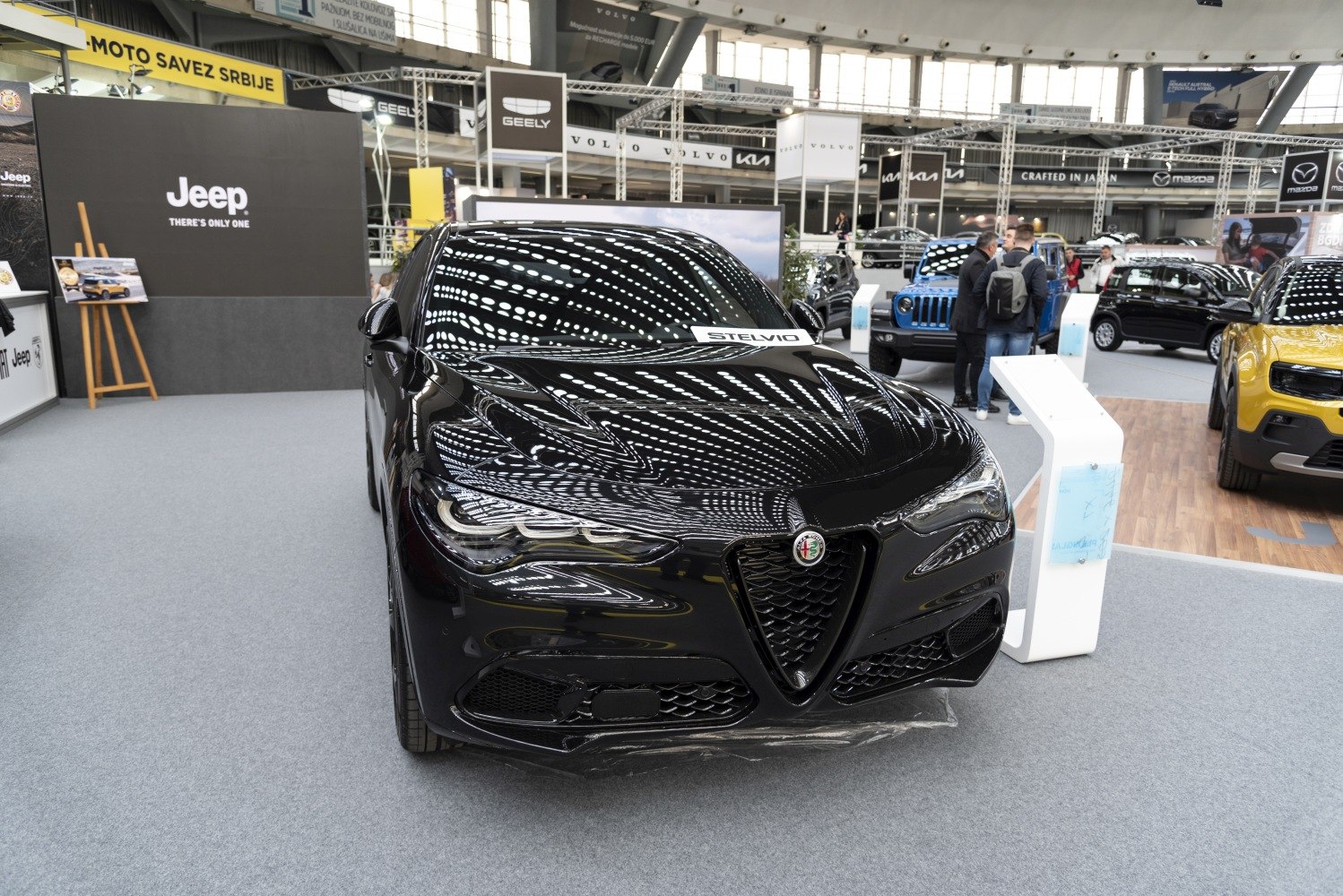 Sleek front design with distinctive triangular grille and sharp headlights