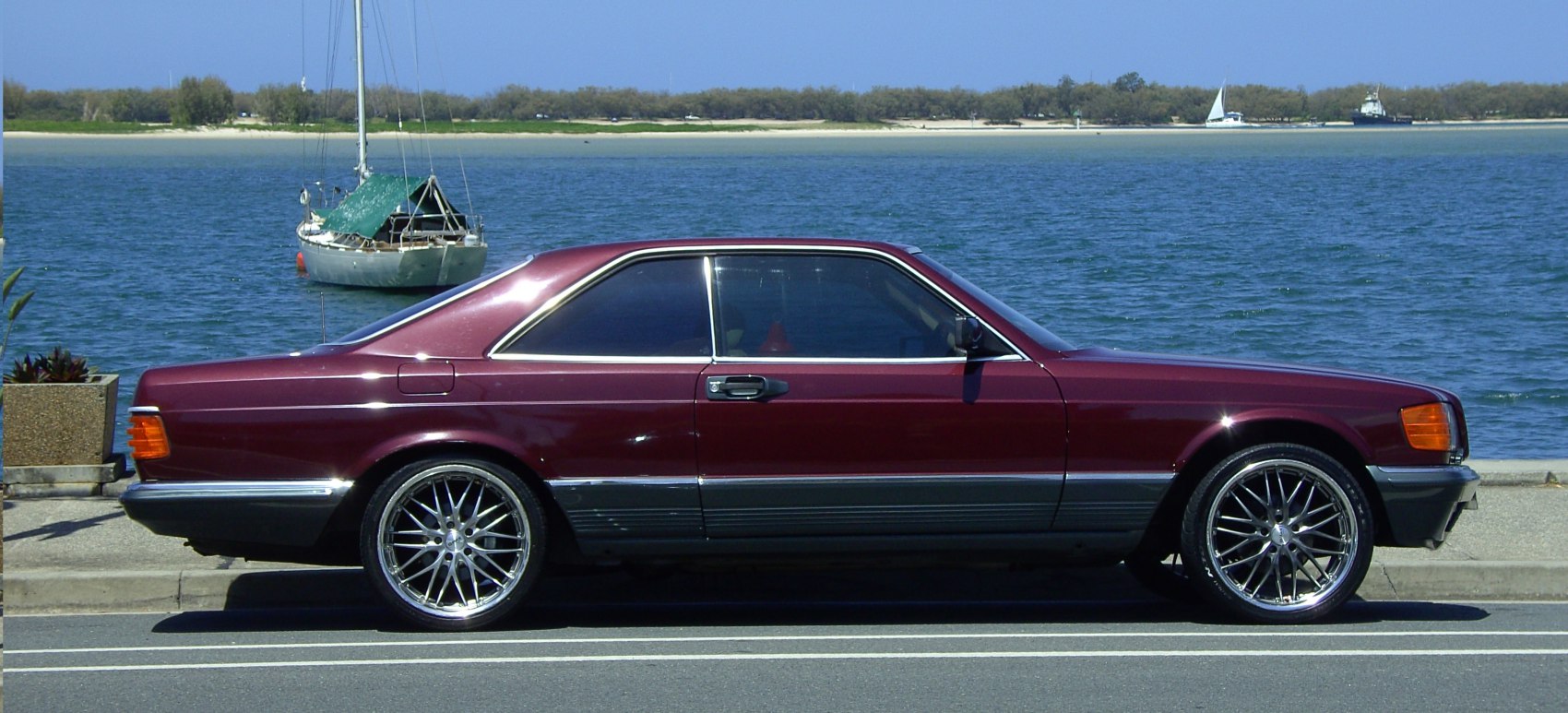 Sleek side profile with modern alloy wheels on classic coupe
