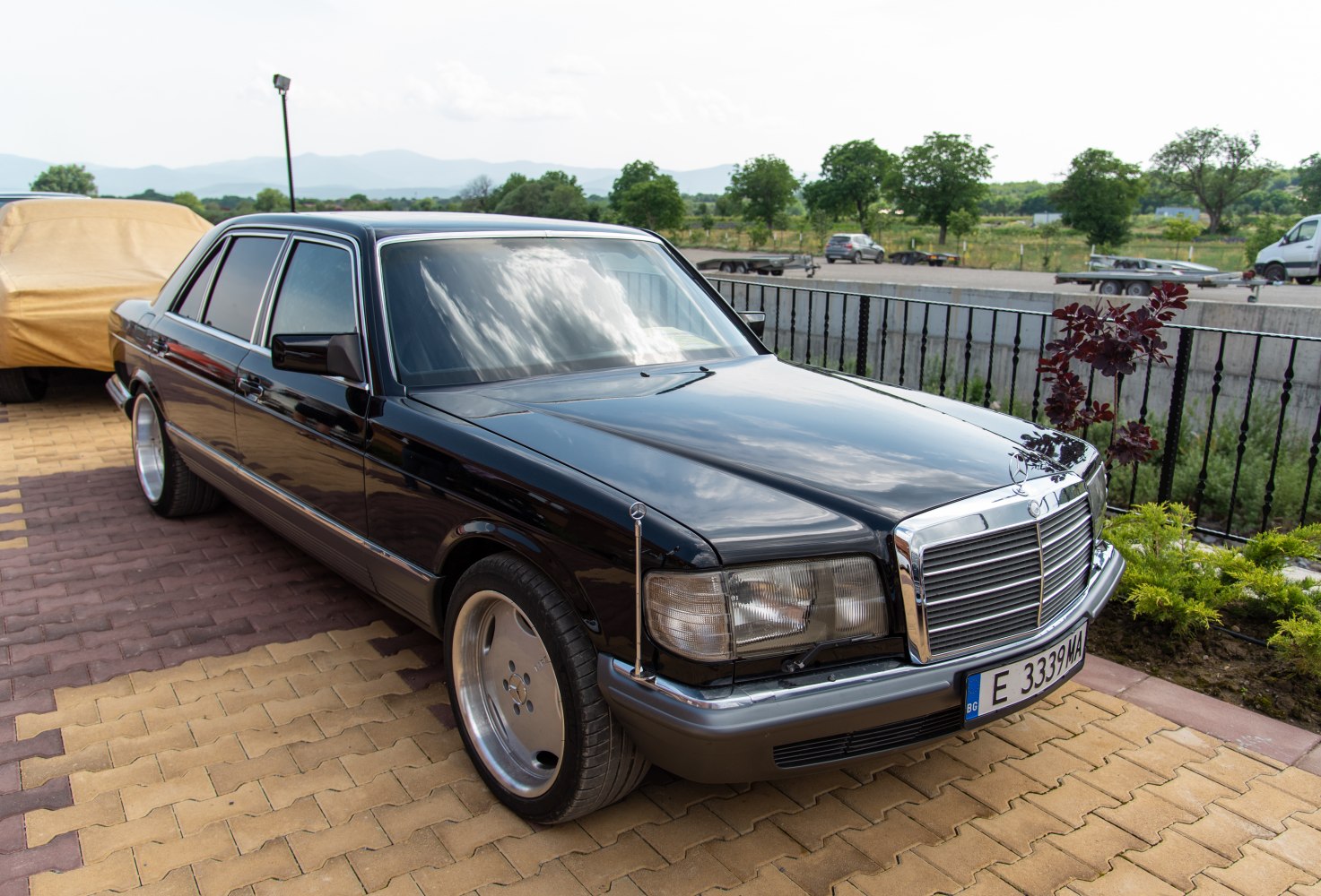 Luxury sedan with chrome grille and wide alloy wheels