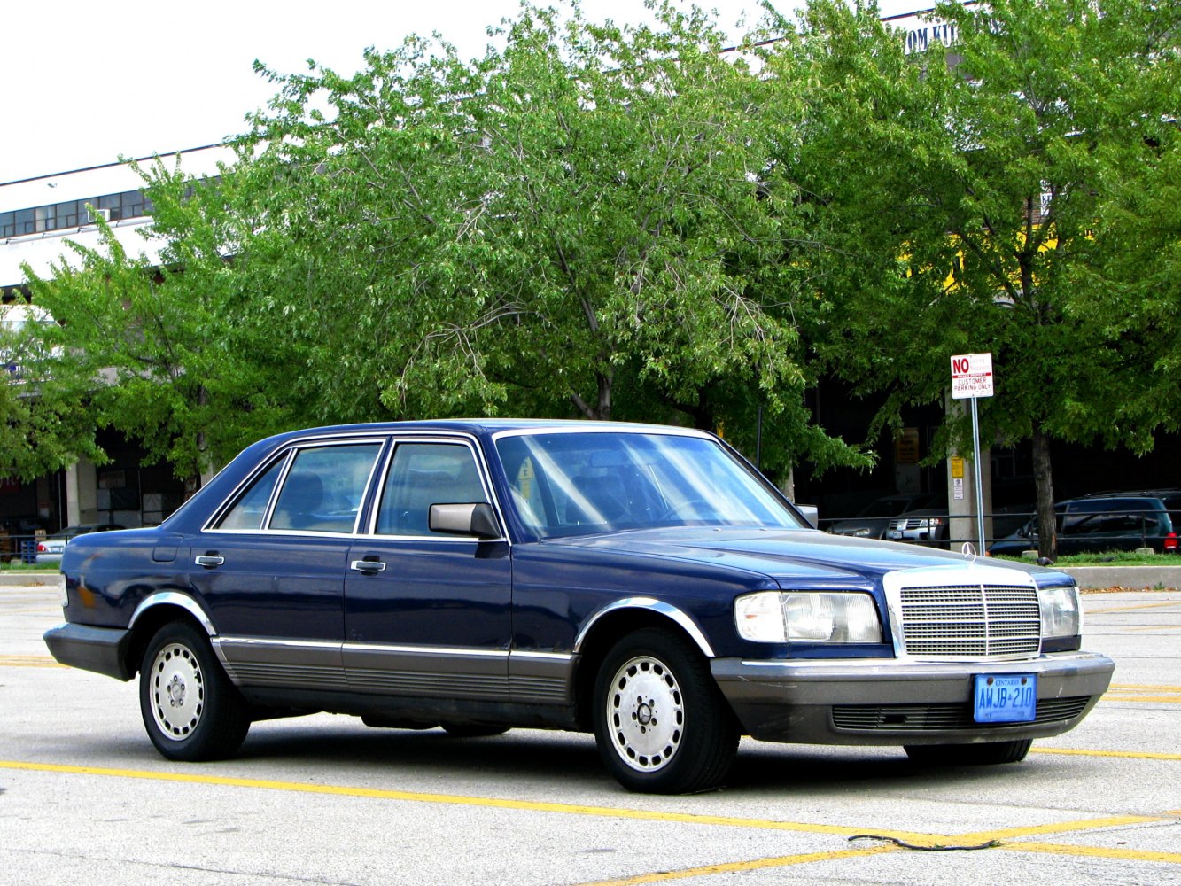 Vintage luxury sedan with rectangular headlights and chrome trim