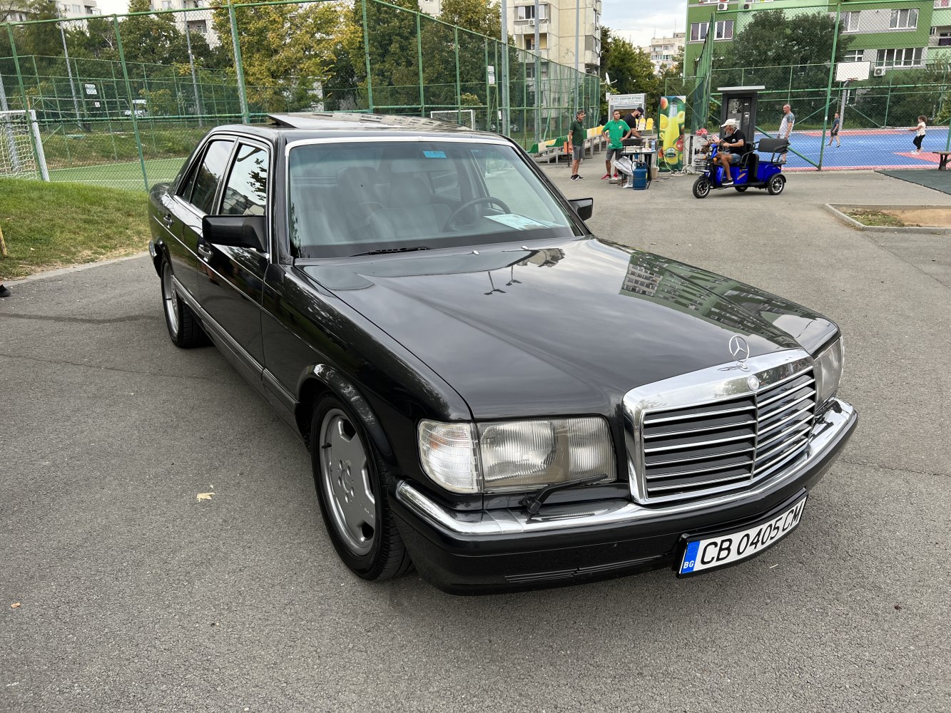 Vintage luxury sedan with chrome grille and angular headlights