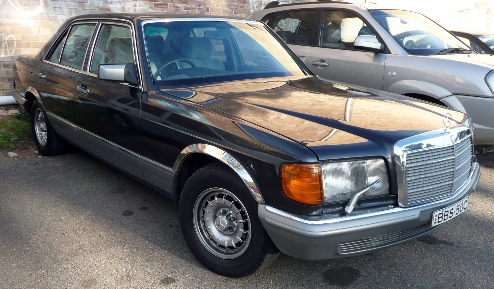 Classic luxury sedan with distinct headlight wiper and chrome grille