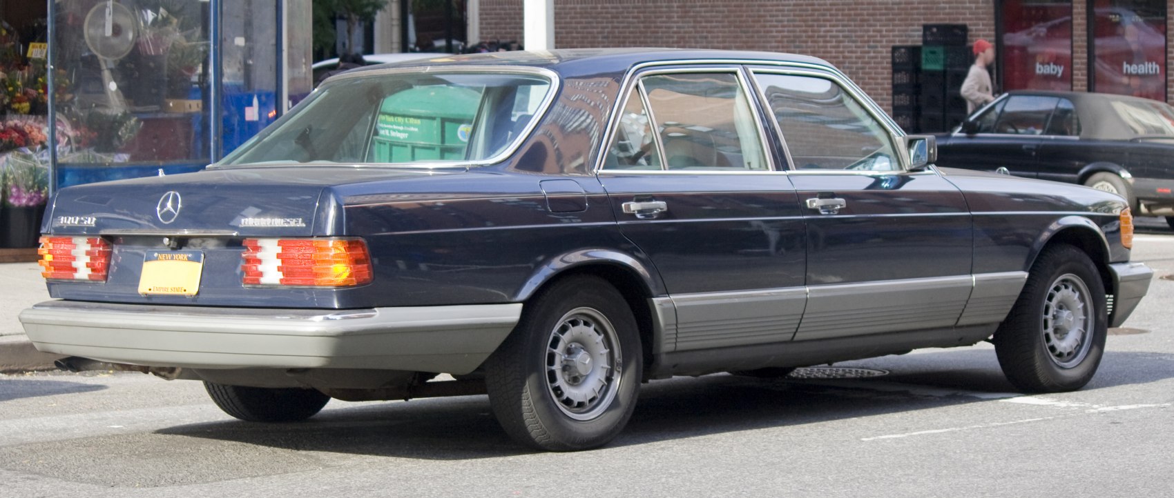Rear view of classic luxury sedan with chrome trim and distinctive taillights