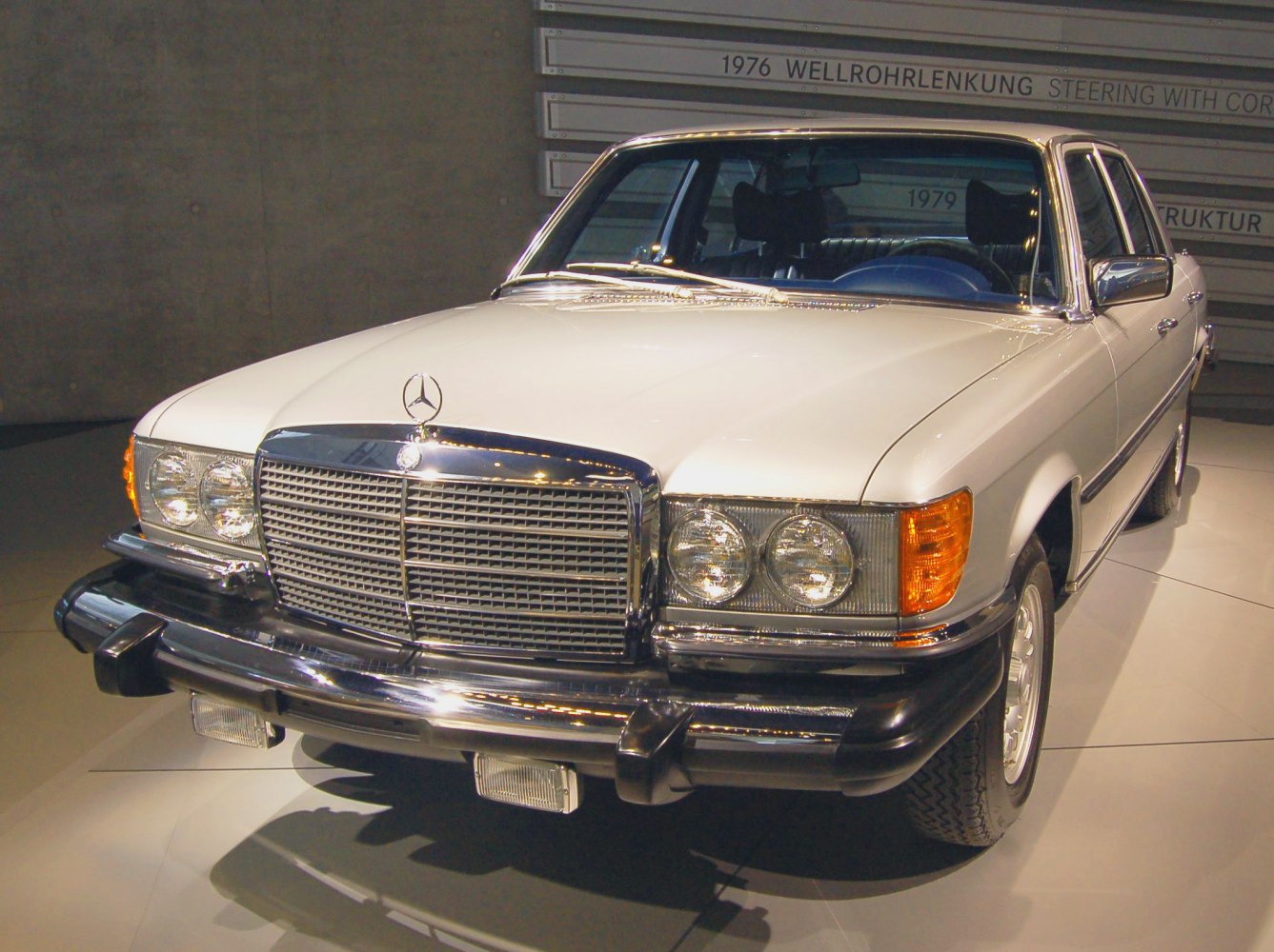 Classic sedan with chrome grille and quad round headlights
