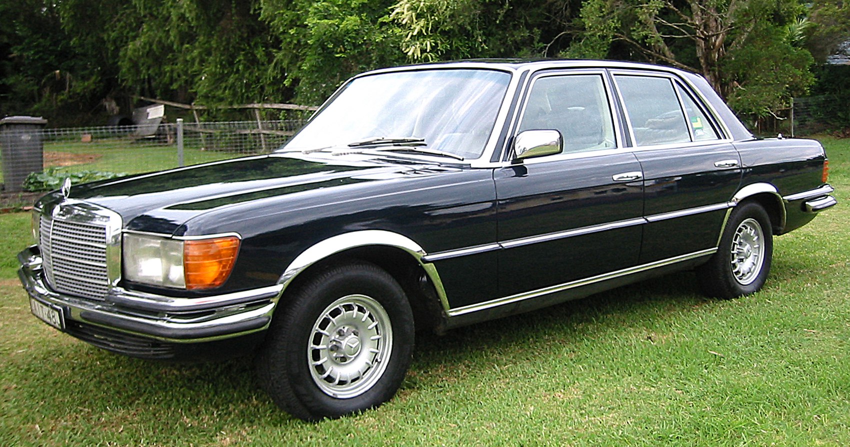 Classic luxury sedan with large front grille and chrome trim