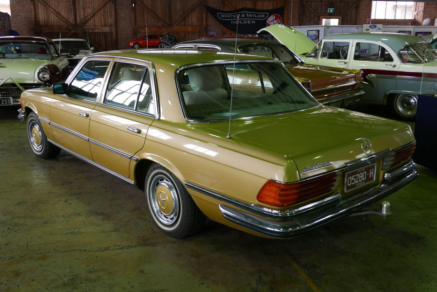 Luxury sedan rear view with chrome trim and distinctive wide taillights