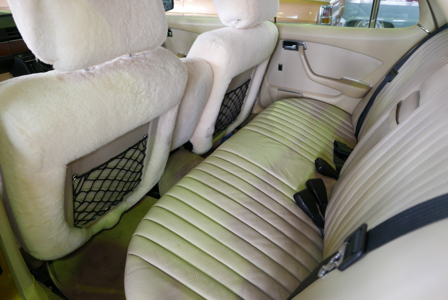 Rear seat with plush sheepskin covers and ribbed leather upholstery