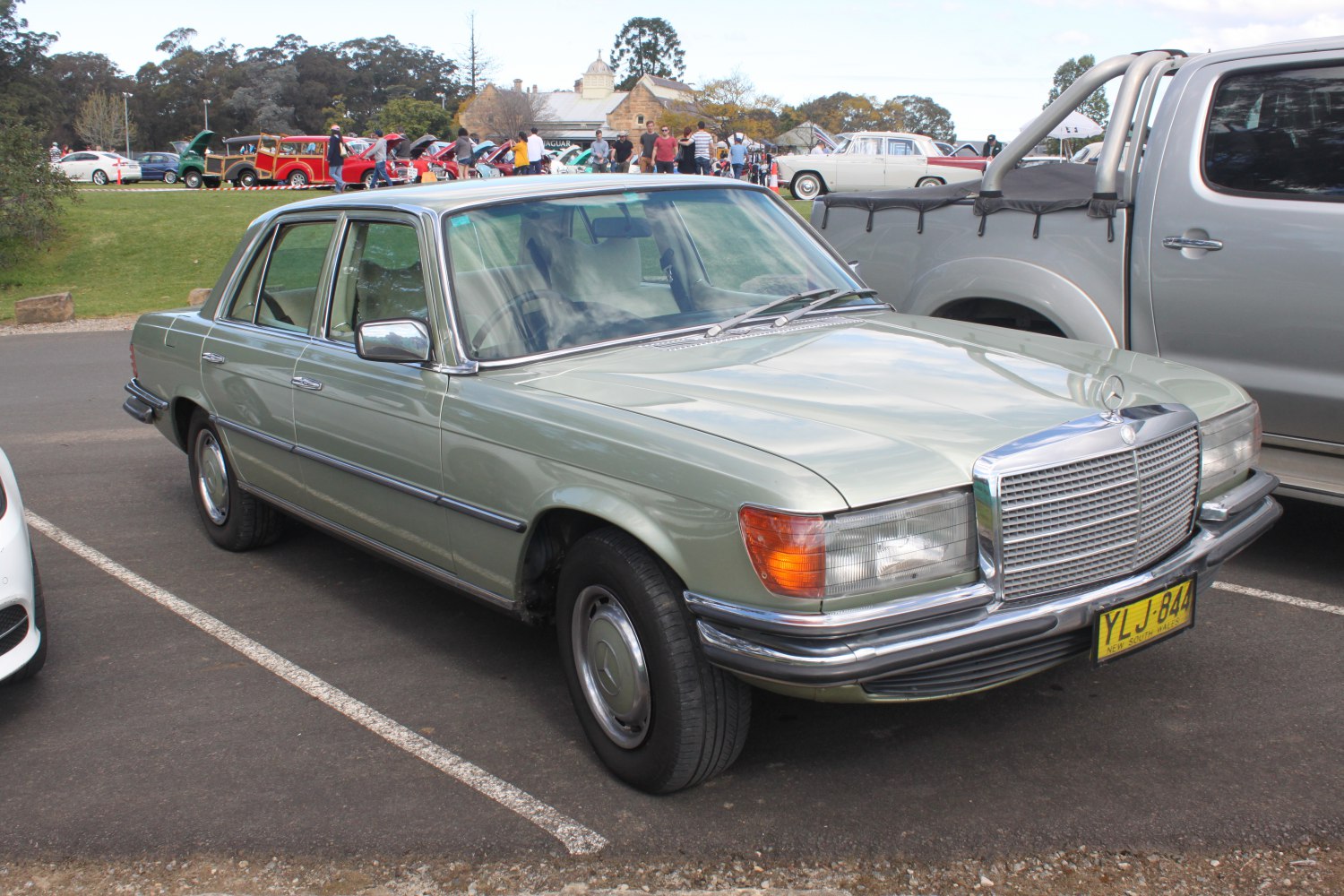 Classic luxury sedan with chrome grille and round headlights