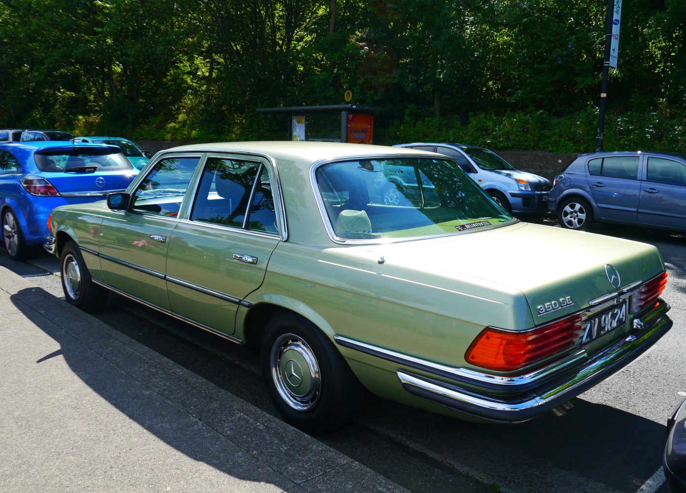 Vintage luxury sedan rear view with chrome bumper and large taillights