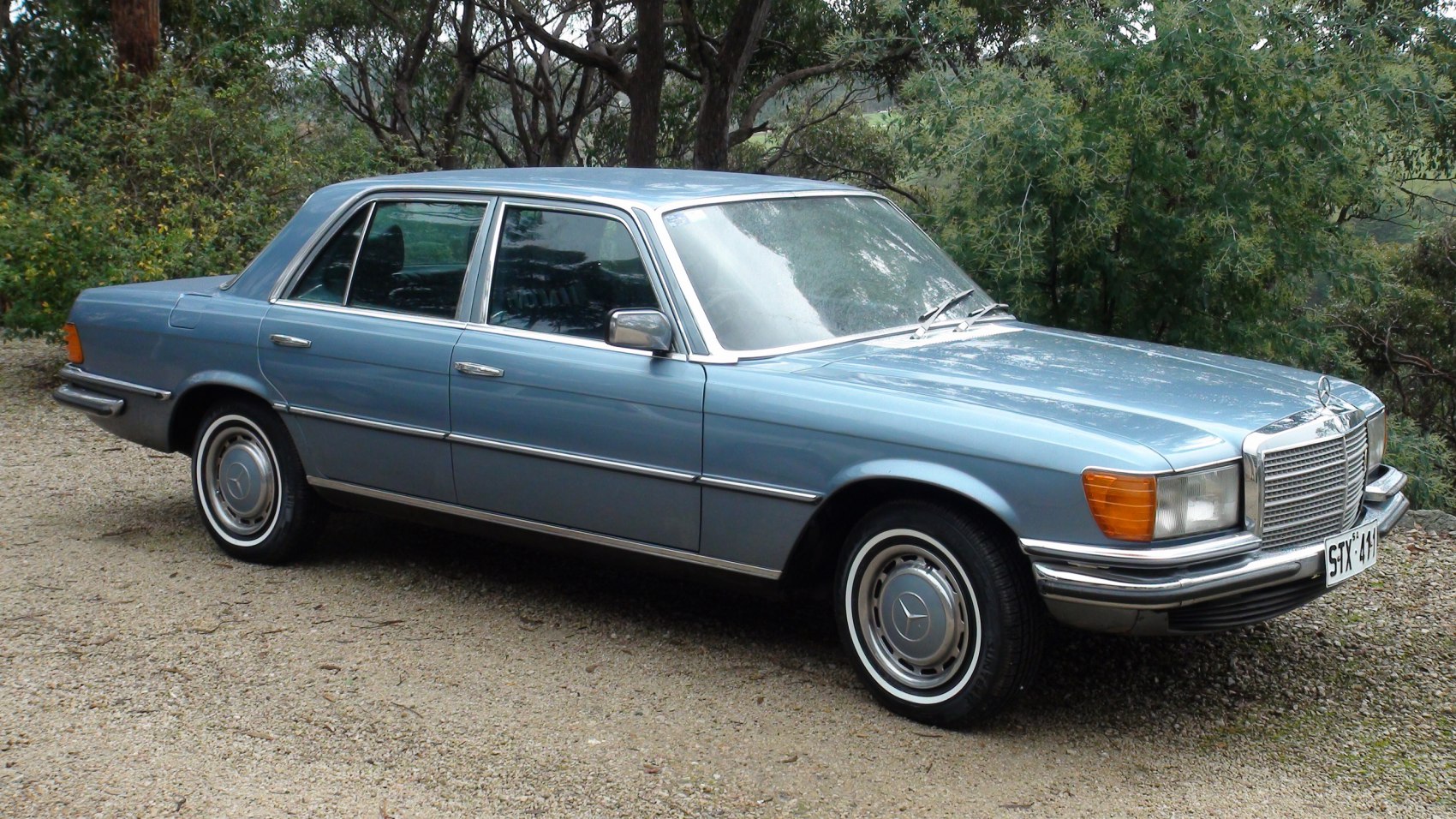 Vintage luxury sedan with chrome trims and classic steel wheels
