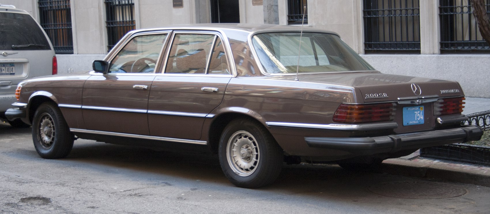 Brown vintage luxury sedan with chrome trim and steel wheels