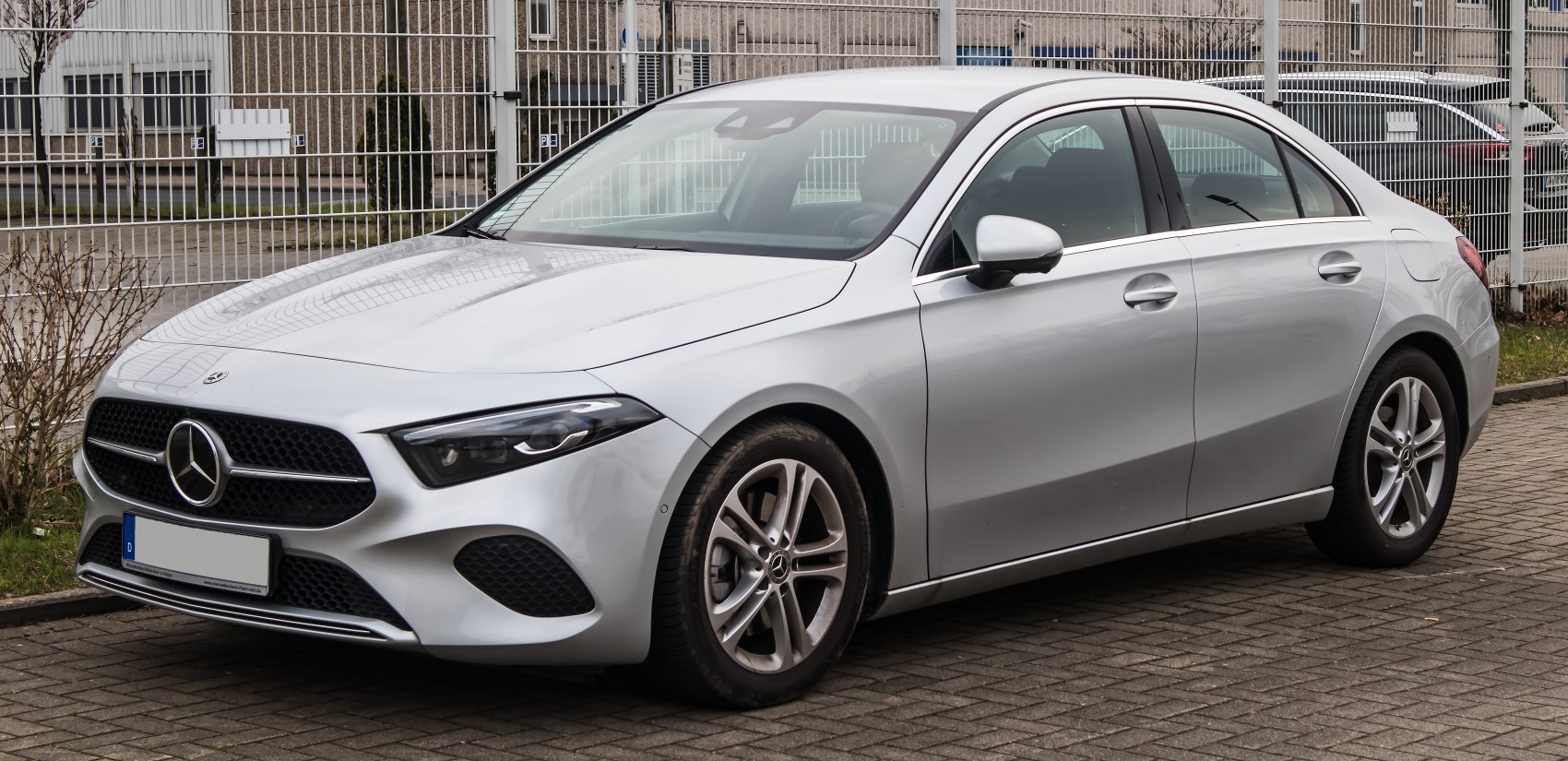 Front-left view of a sedan with LED headlights and alloy wheels