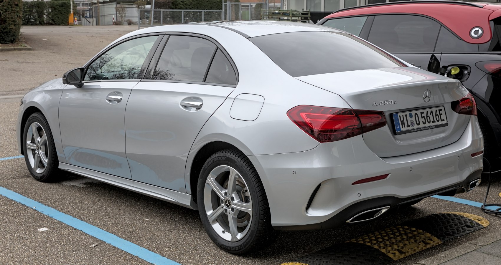 Rear view of sedan with LED tail lights and dual exhaust tips