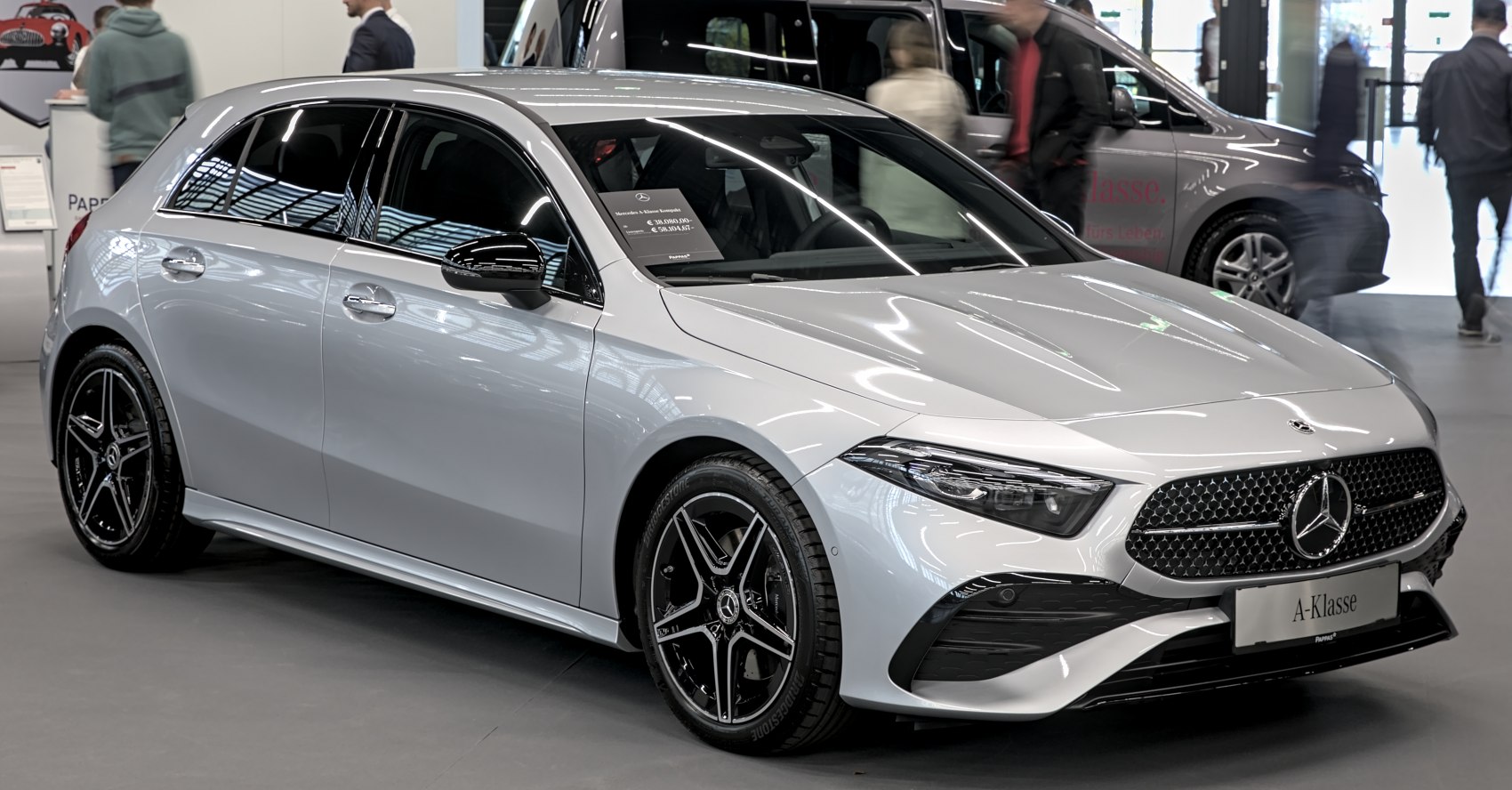 Front-side view with modern grille and black alloy wheels