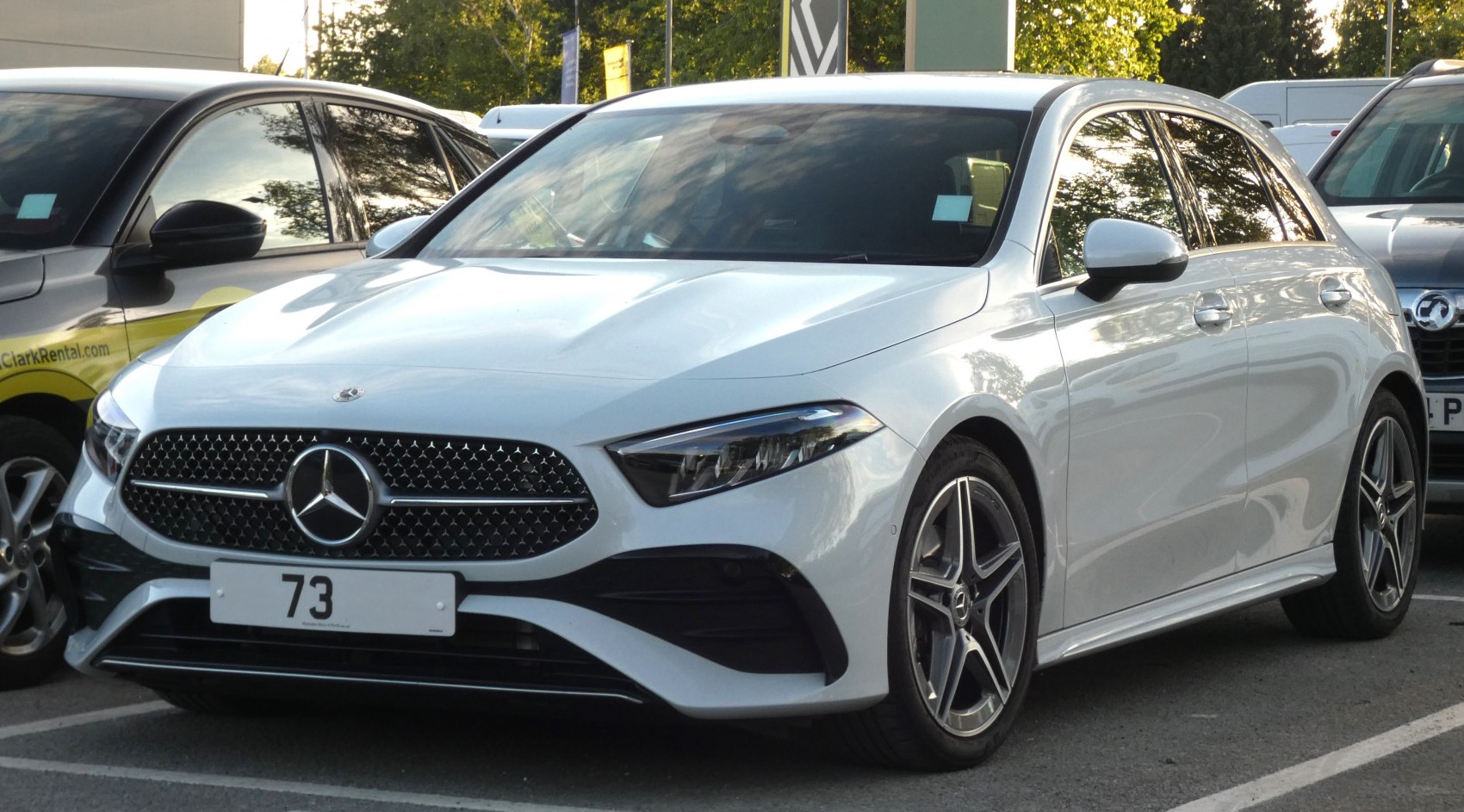 Front grille and star-spoke alloy wheels of a modern hatchback.