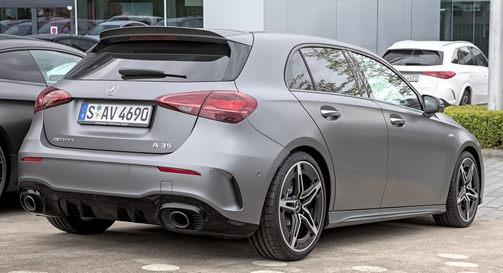 Rear and side view with dual exhaust and sporty wheels