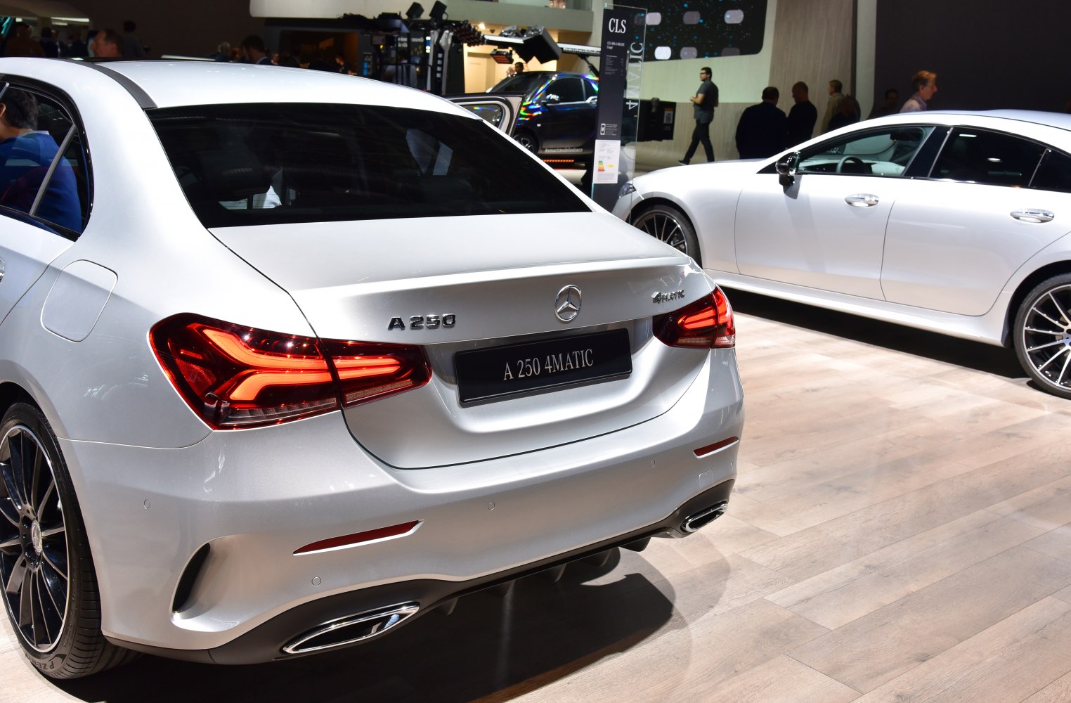 LED tail lights and dual exhaust in rear sedan view