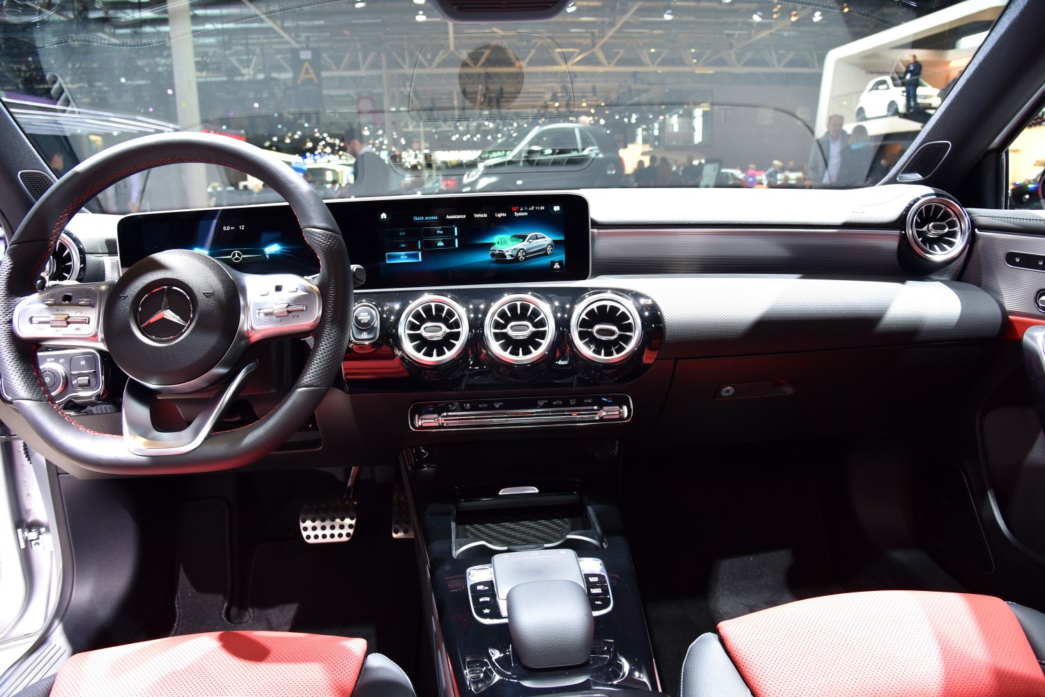 Modern digital dashboard and circular air vents in luxury vehicle interior