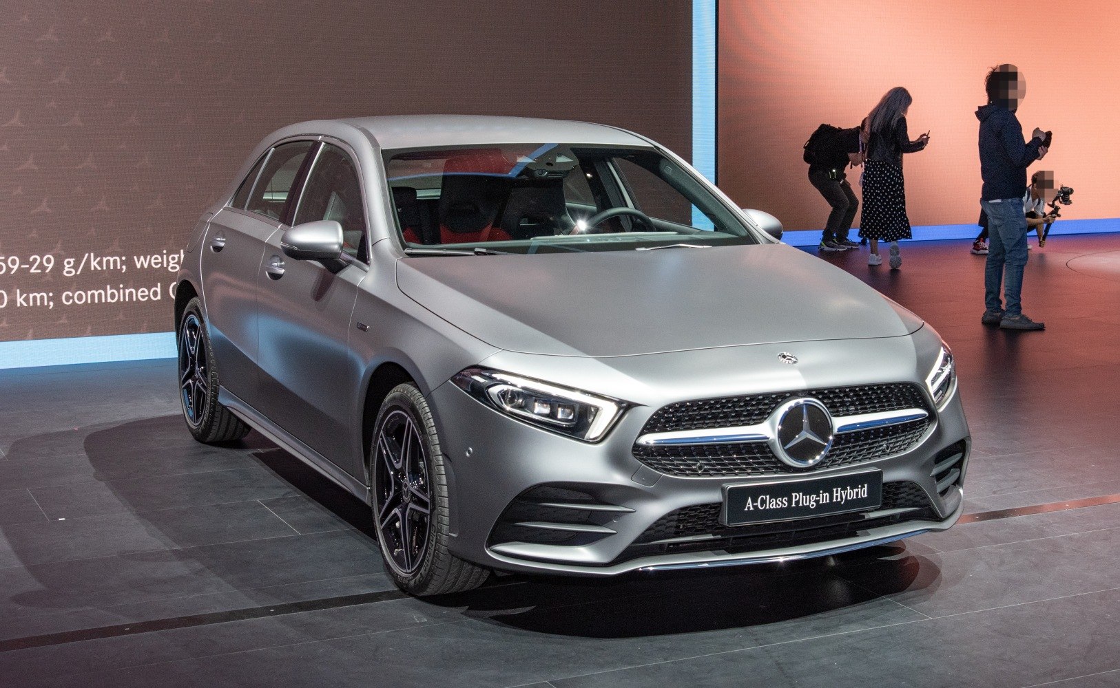 Sleek front view showing LED headlights and signature grille of a plug-in hybrid.