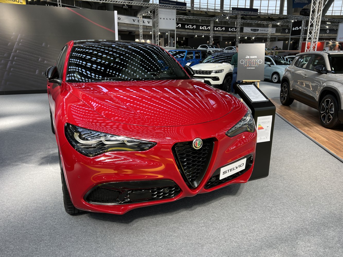 Front grille and headlights of a red luxury SUV