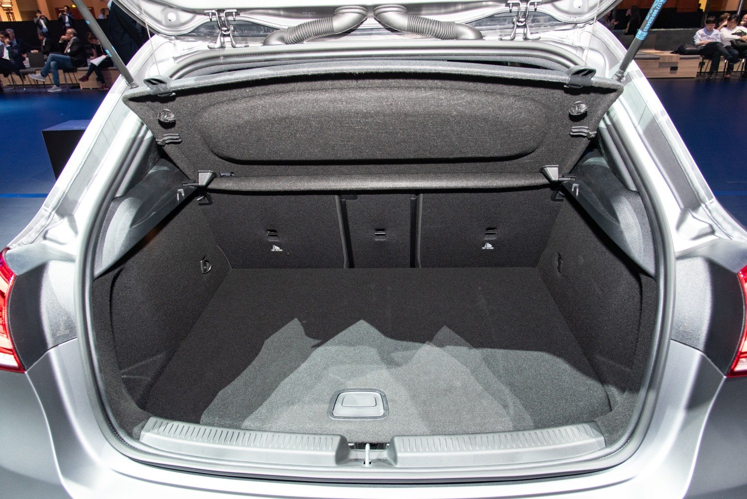 Open spacious rear trunk with carpeted interior and fold-down rear seats.