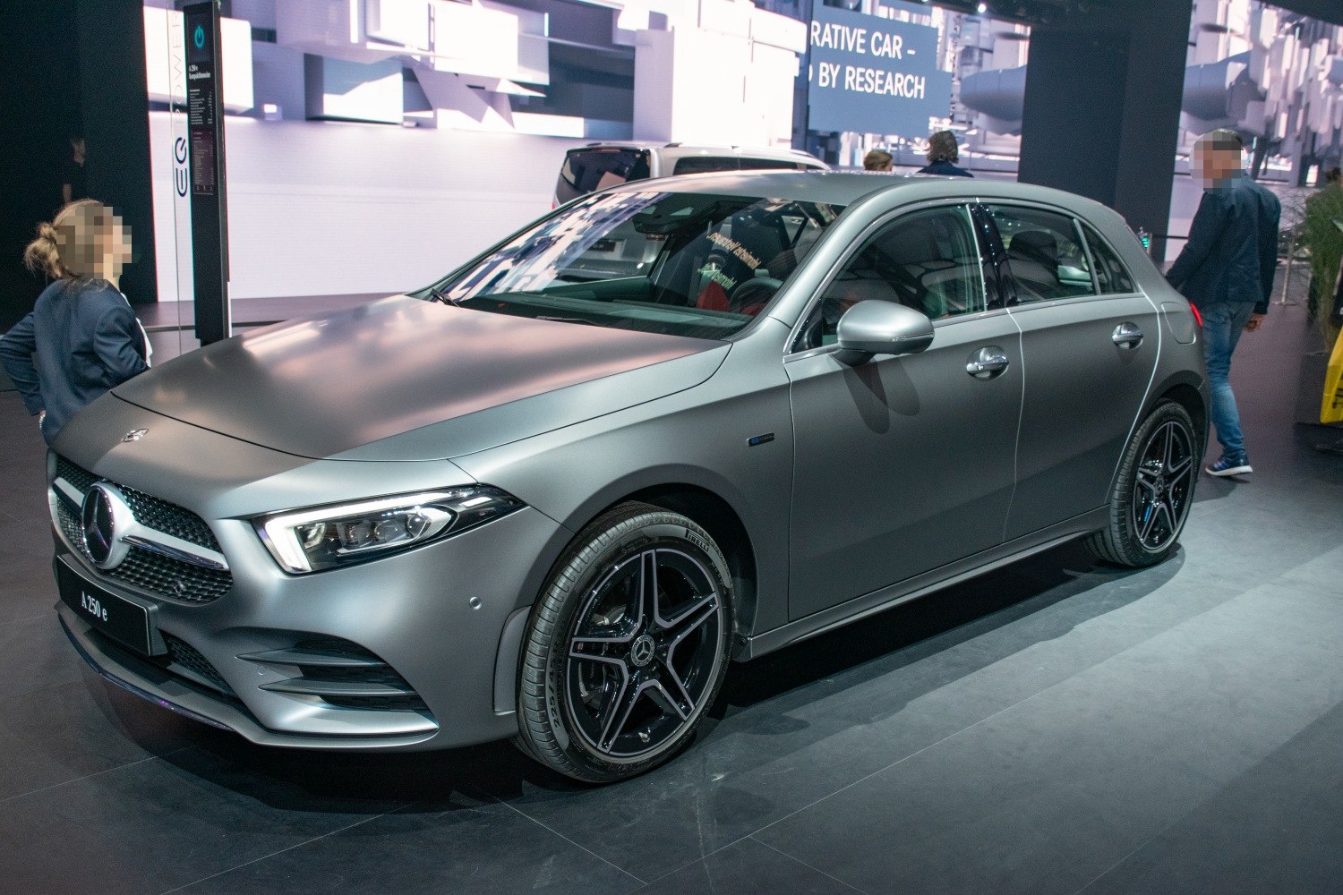 Front-side view of hatchback with sharp headlights and alloy wheels